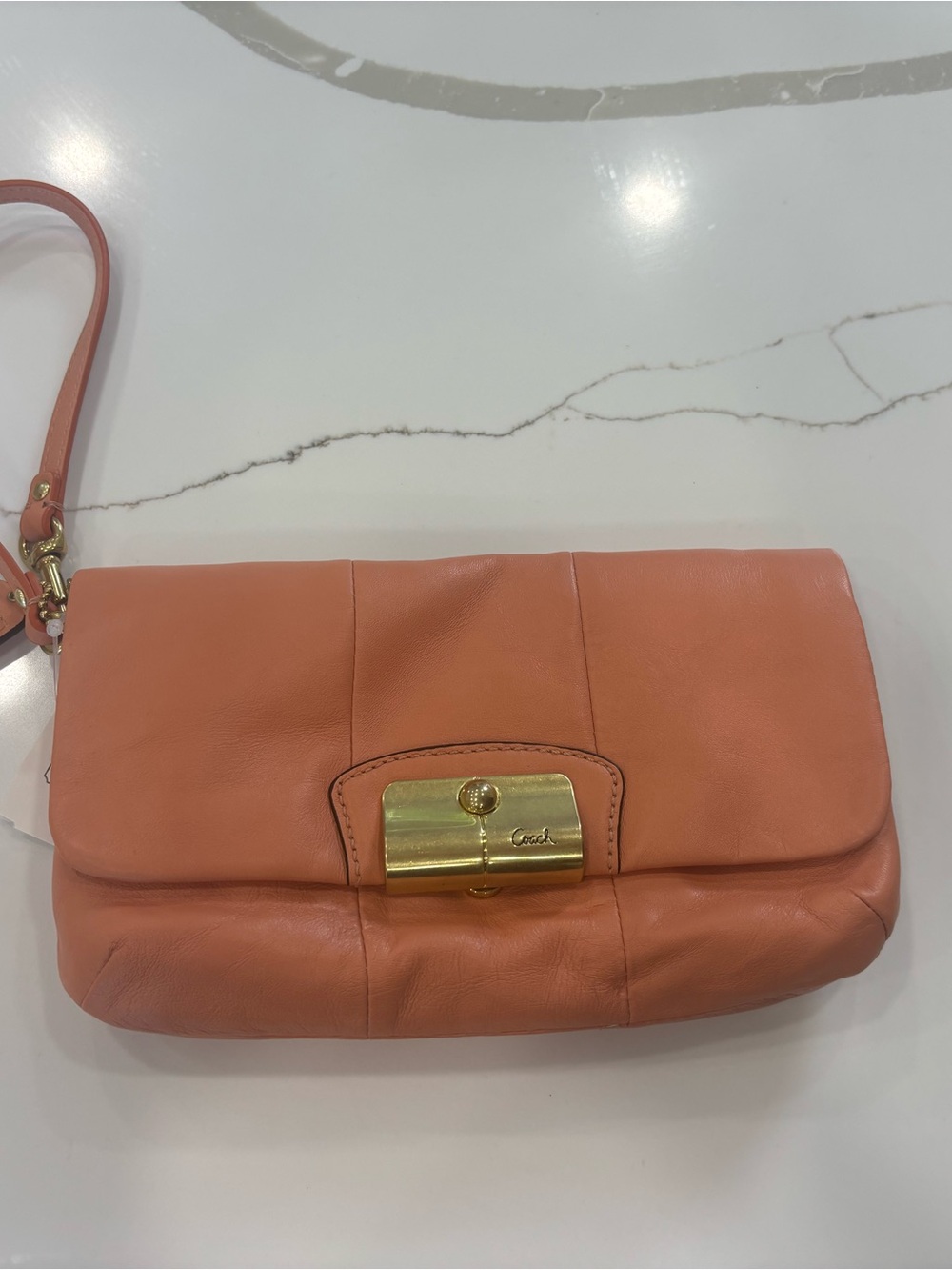 Coach Coral-Orange Leather Wristlet with Gold Turnlock